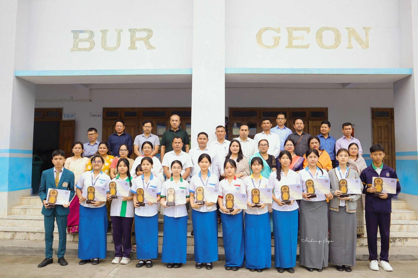 Students and teachers celebrating academic achievement